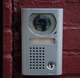 A typical door entry system incuding minature camera